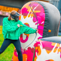 Kid playing Archery Tag behind inflatable cover during a Battle Zone birthday party at Gripped London.