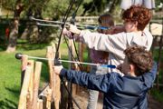 Children taking part in archery activity at Hobbledown Epsom