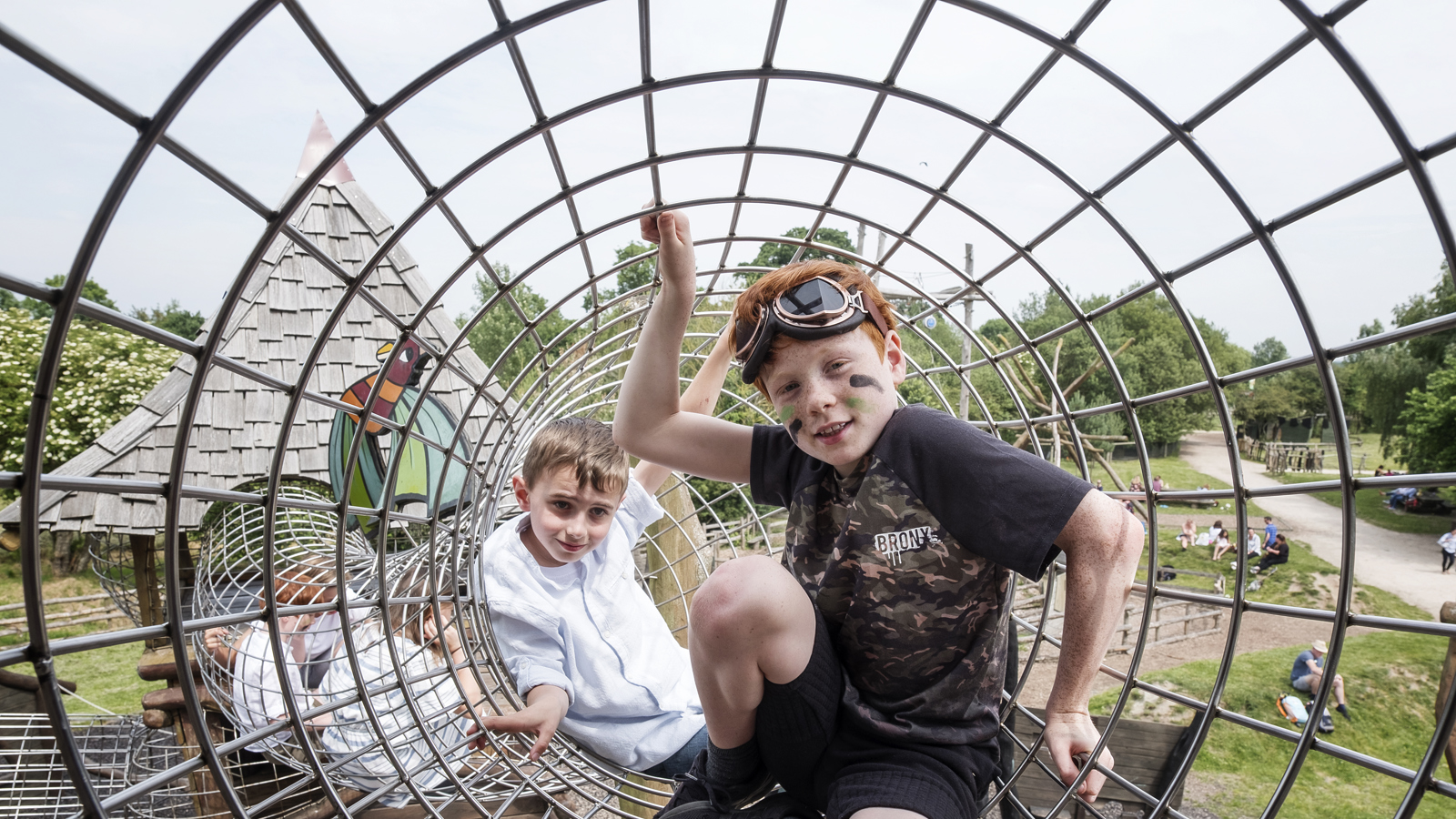Boys in wire tunnel