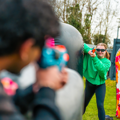 Child aiming a Nerf blaster during a Battle Zone birthday party game at Gripped London.