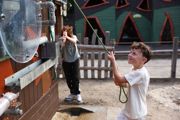 Children playing with interactive water pumps and sprays at Hobbledown Epsom playground