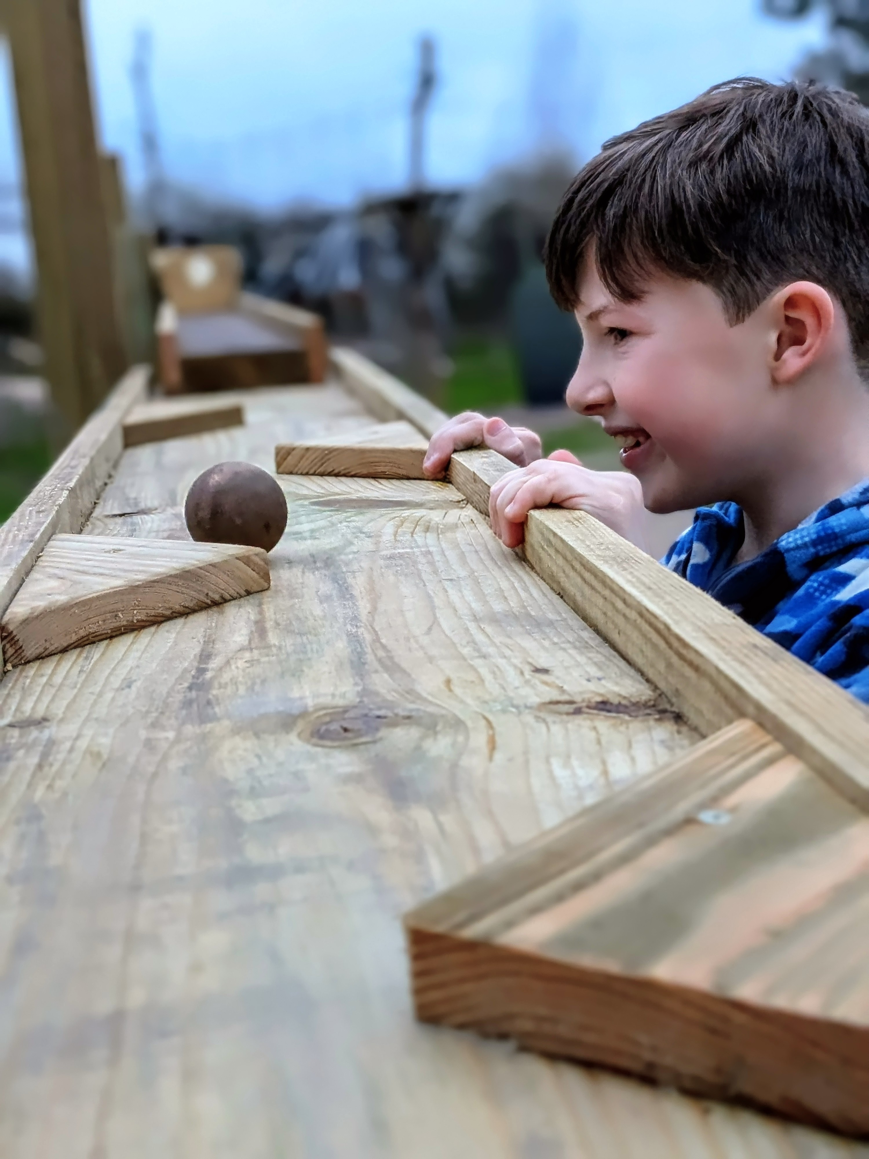child enjoying marble runs at Hobbledown Epsom