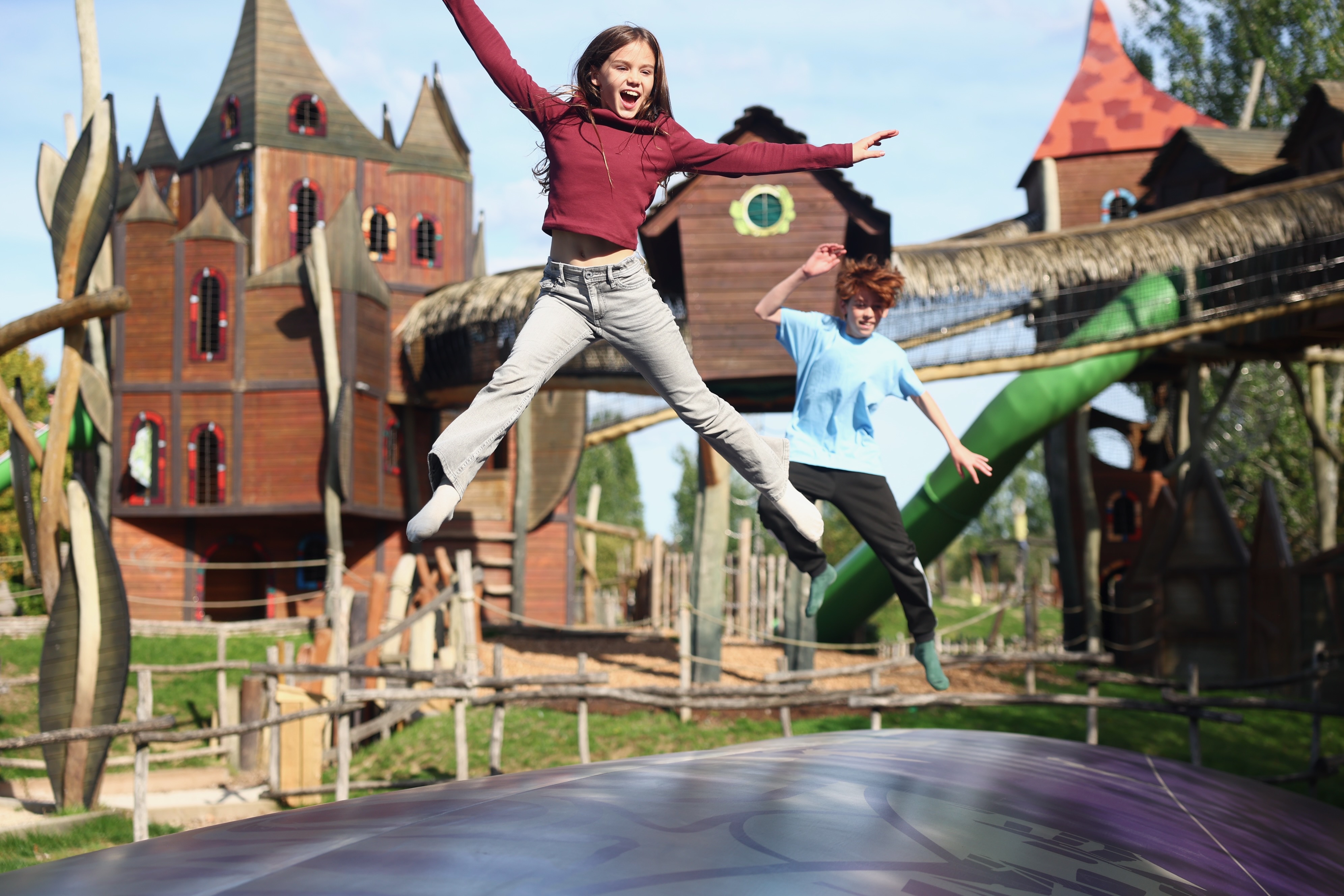 Kids enjoying outdoor play and jumping pillow at Hobbledown Epsom Surrey adventure playground