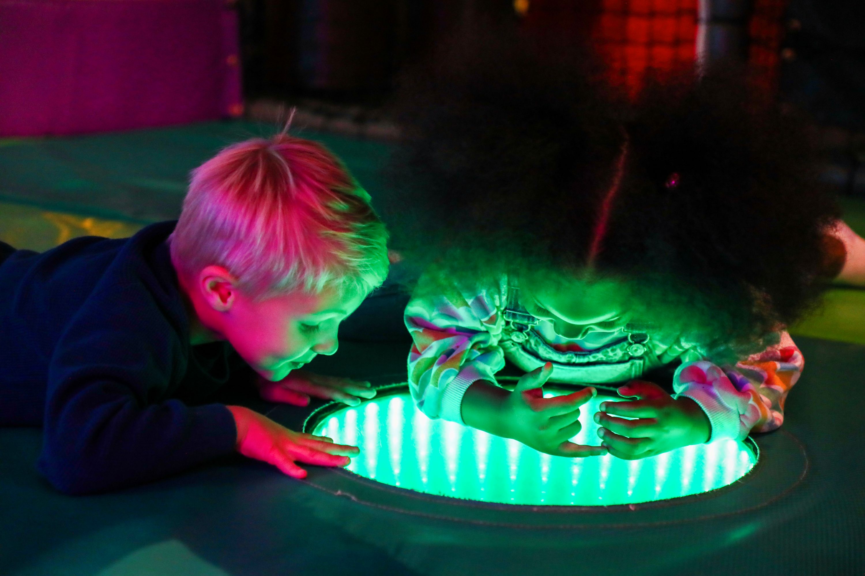 Toddler enjoying sensory play area at indoor play area in Hounslow